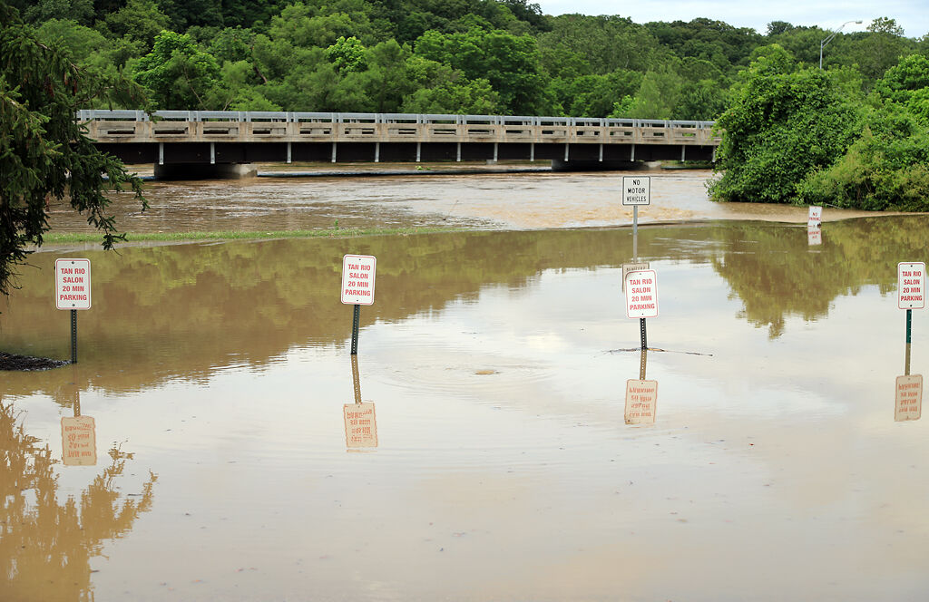 Hinkson Creek floods Wilson's Fitness parking lot.